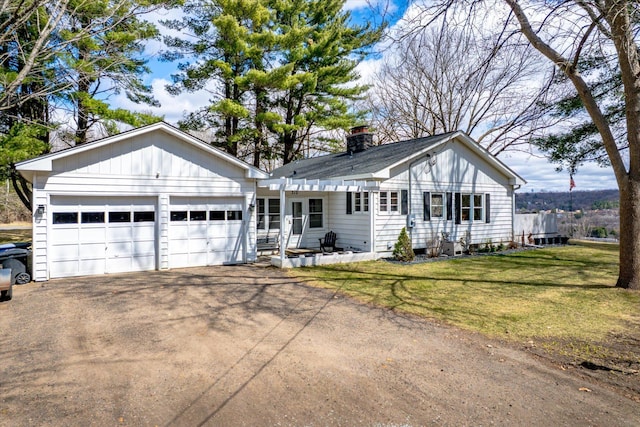 312 Walnut St, Taylors Falls, MN 55084 - single story home with driveway, a chimney, an attached garage, and a front yard