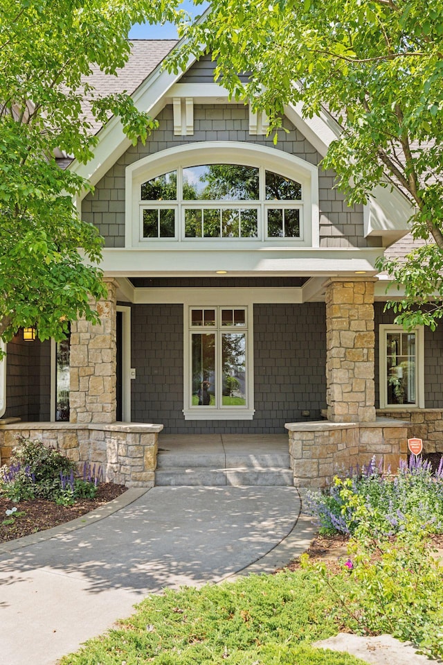 9726 Whistling Valley Rd, Lake Elmo, MN 55042 - view of front of home with a porch and stone siding