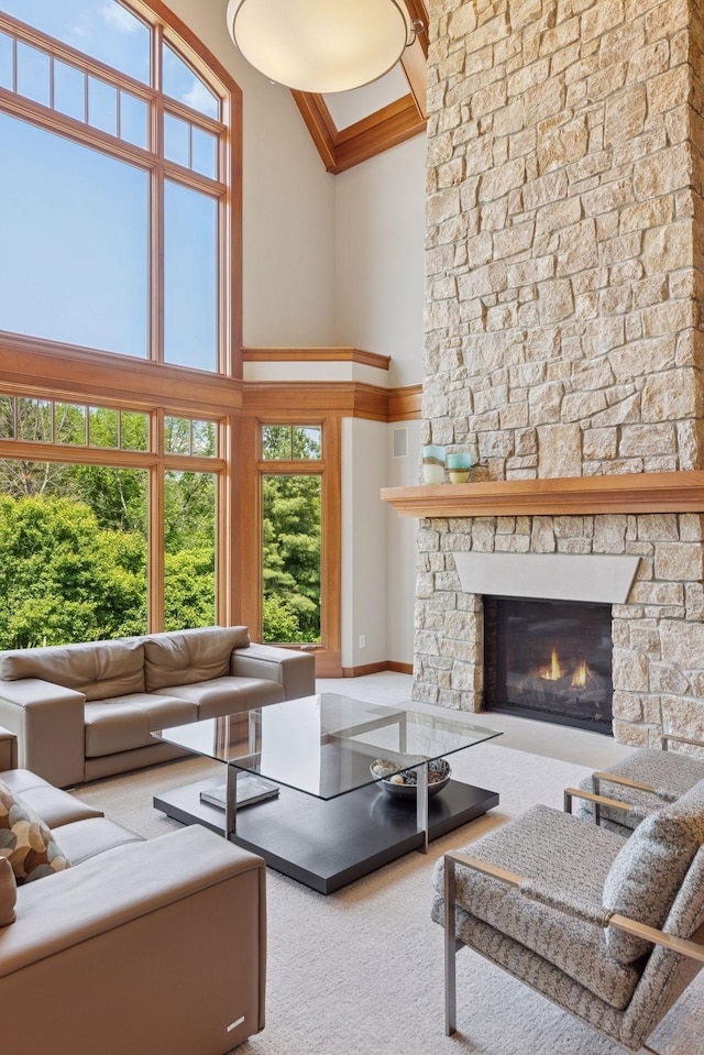 9726 Whistling Valley Rd, Lake Elmo, MN 55042 - carpeted living area with high vaulted ceiling and a stone fireplace