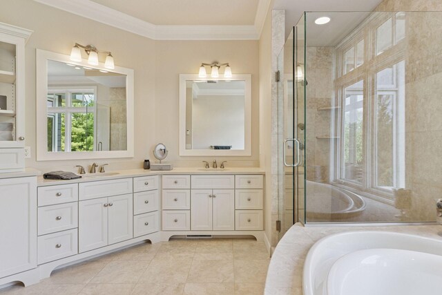 9726 Whistling Valley Rd, Lake Elmo, MN 55042 - bathroom featuring crown molding, double vanity, a garden tub, a shower stall, and tile patterned floors