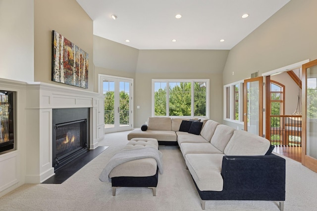 9726 Whistling Valley Rd, Lake Elmo, MN 55042 - living area featuring recessed lighting, carpet flooring, a fireplace with flush hearth, and high vaulted ceiling