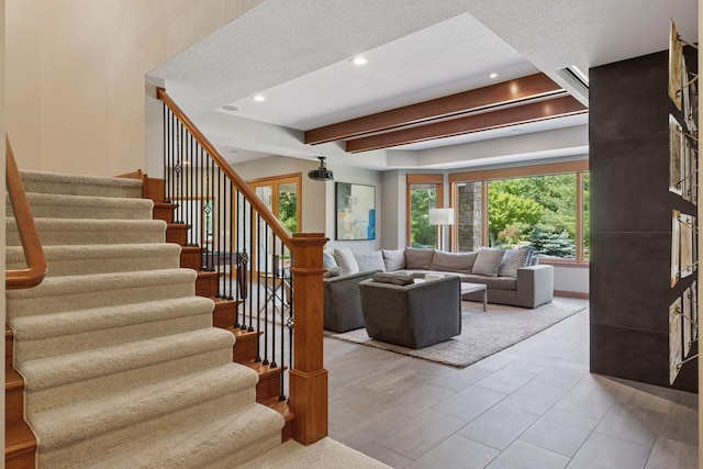 9726 Whistling Valley Rd, Lake Elmo, MN 55042 - living room featuring stairway, beam ceiling, a textured ceiling, and recessed lighting