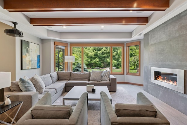 9726 Whistling Valley Rd, Lake Elmo, MN 55042 - living area featuring a tile fireplace, beamed ceiling, and recessed lighting