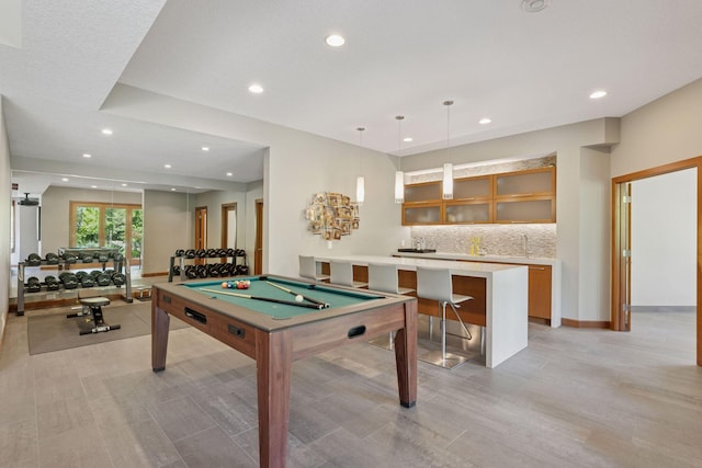 9726 Whistling Valley Rd, Lake Elmo, MN 55042 - playroom featuring pool table, recessed lighting, light wood finished floors, baseboards, and wet bar