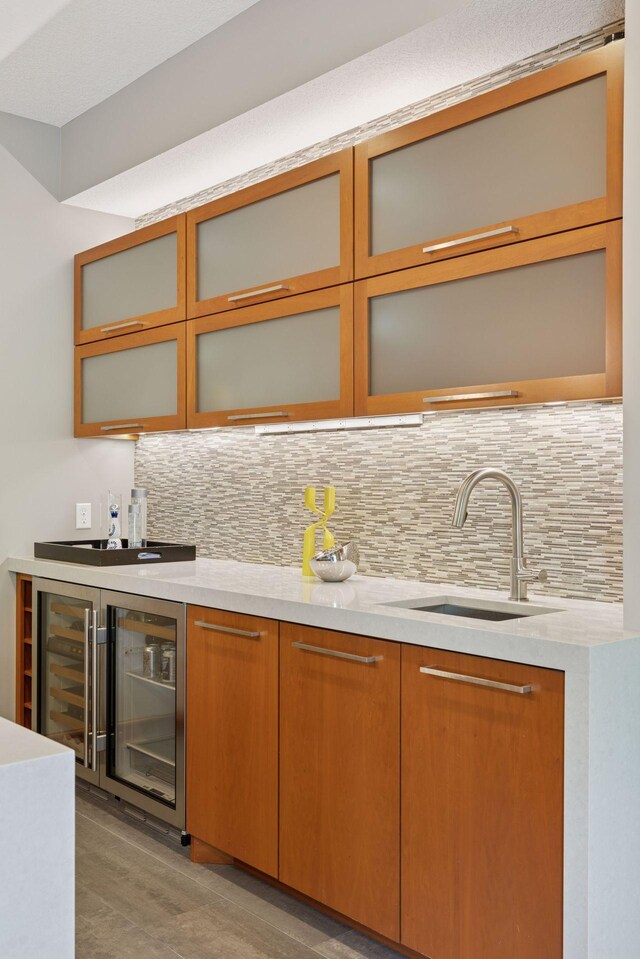 9726 Whistling Valley Rd, Lake Elmo, MN 55042 - indoor bar featuring tasteful backsplash and beverage cooler