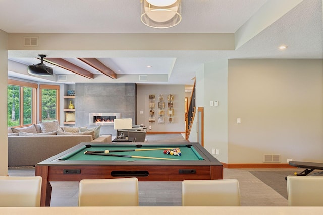 9726 Whistling Valley Rd, Lake Elmo, MN 55042 - recreation room with beam ceiling, a tiled fireplace, baseboards, pool table, and recessed lighting