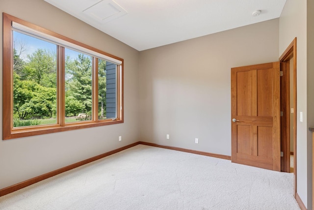 9726 Whistling Valley Rd, Lake Elmo, MN 55042 - unfurnished room with baseboards, light carpet, and a smoke detector