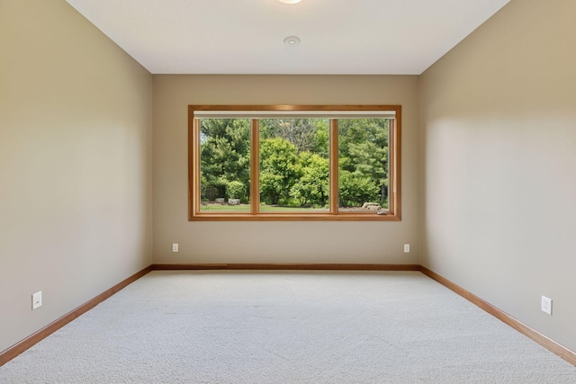 9726 Whistling Valley Rd, Lake Elmo, MN 55042 - unfurnished room featuring light colored carpet and baseboards