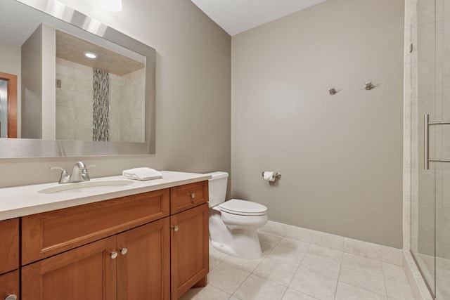9726 Whistling Valley Rd, Lake Elmo, MN 55042 - bathroom featuring a stall shower, vanity, toilet, tile patterned flooring, and baseboards