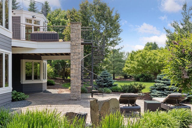 9726 Whistling Valley Rd, Lake Elmo, MN 55042 - view of patio with stairs and view of scattered trees