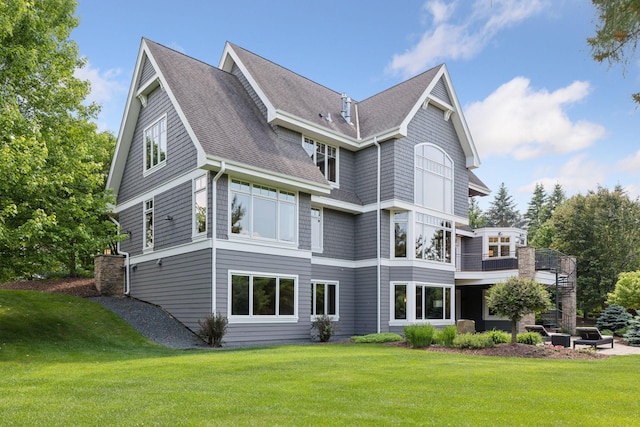 9726 Whistling Valley Rd, Lake Elmo, MN 55042 - rear view of property with a yard, a shingled roof, and a balcony
