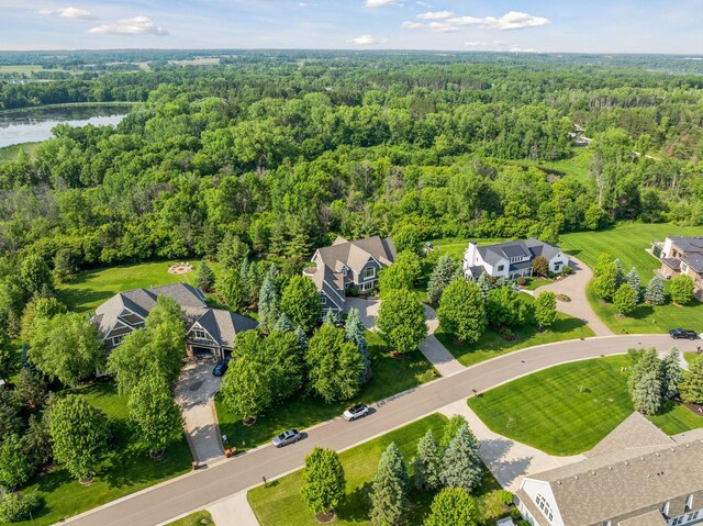 9726 Whistling Valley Rd, Lake Elmo, MN 55042 - aerial perspective of suburban area with a forest and a large body of water