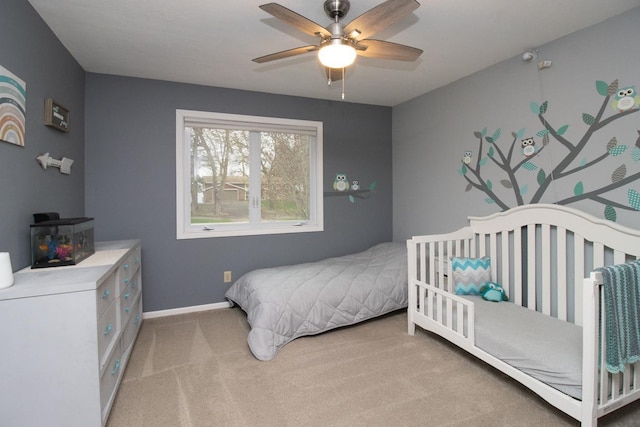 bedroom featuring baseboards, a ceiling fan, and carpet