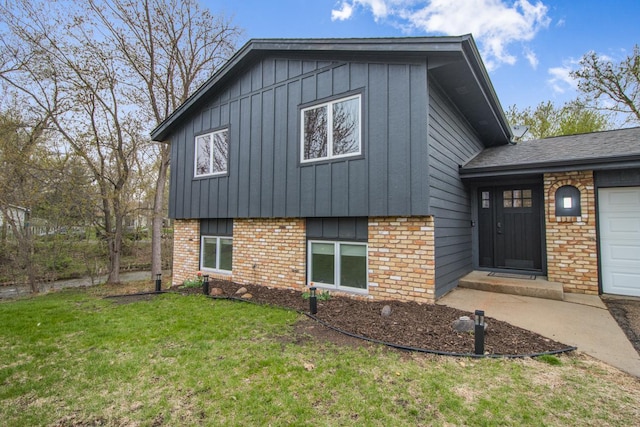 exterior space with brick siding, board and batten siding, and a lawn