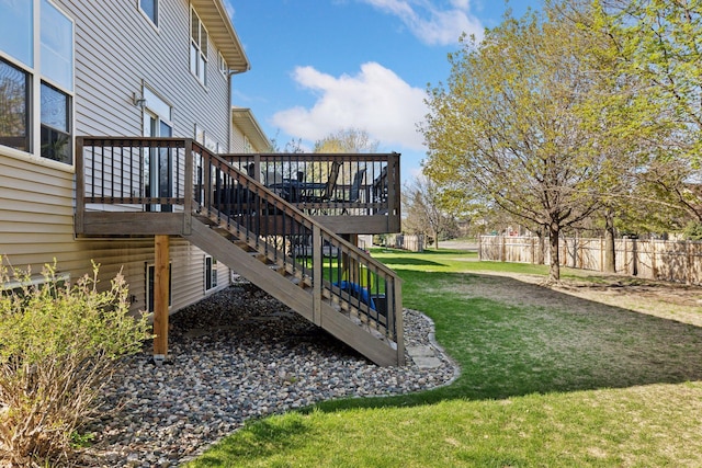 view of yard with stairs and a deck