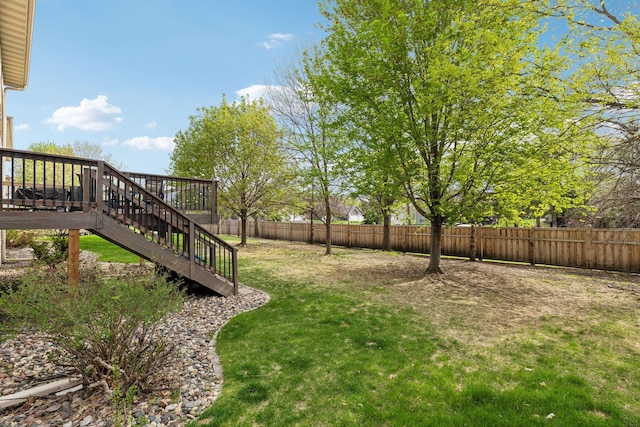 view of yard featuring stairway and a deck