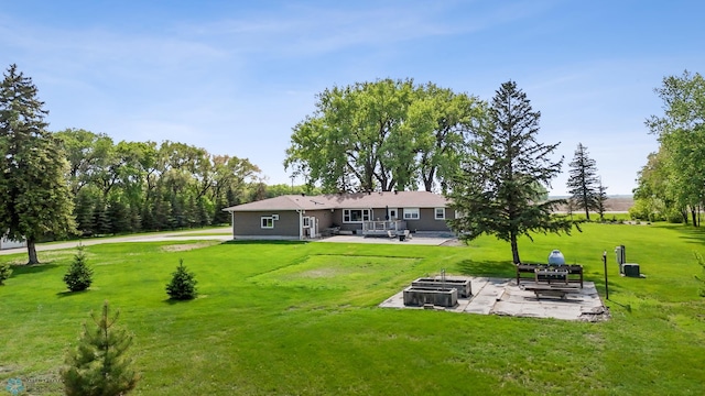 2368 State Highway 9 N, Spring Prairie Twp, MN 56547 - back of property with a fire pit, a patio area, and a lawn