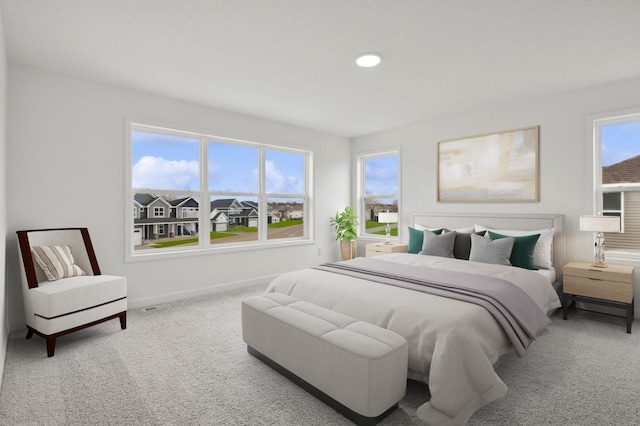 carpeted bedroom with baseboards, recessed lighting, and visible vents
