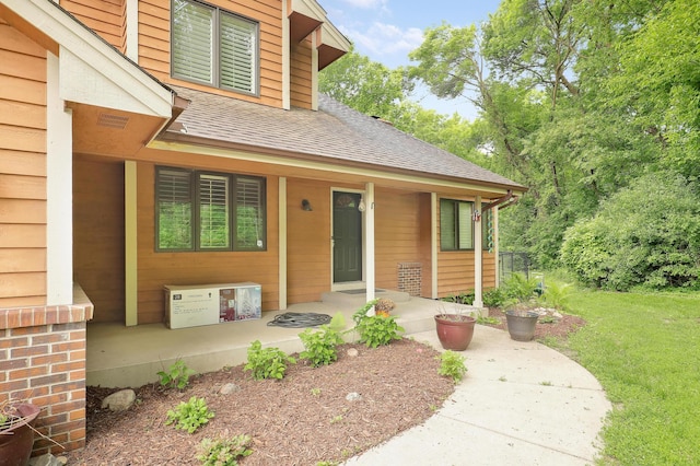 655 Trails End Rd, Minnetrista, MN 55364 - entrance to property featuring covered porch, a shingled roof, and a yard