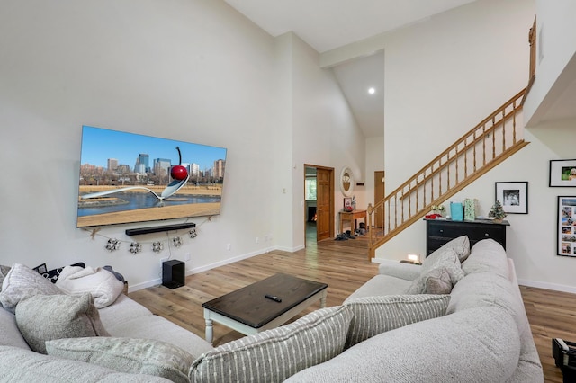 655 Trails End Rd, Minnetrista, MN 55364 - living area with high vaulted ceiling, stairway, wood finished floors, baseboards, and recessed lighting