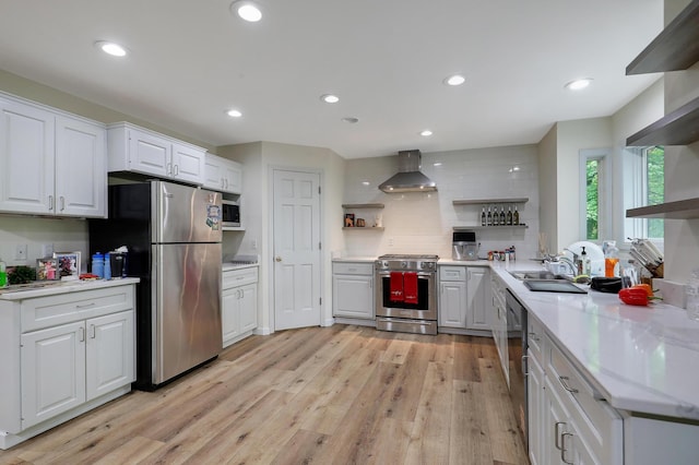 655 Trails End Rd, Minnetrista, MN 55364 - kitchen with open shelves, stainless steel appliances, wall chimney exhaust hood, light wood-style floors, and recessed lighting
