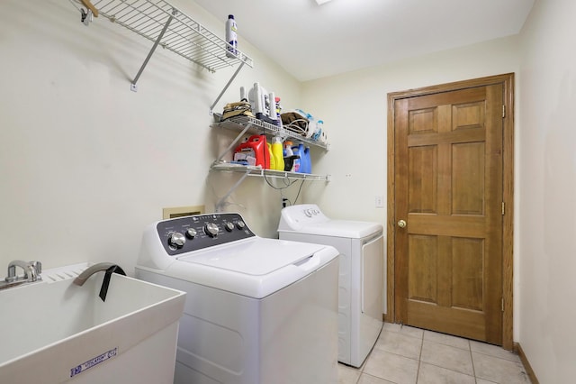 655 Trails End Rd, Minnetrista, MN 55364 - laundry room with washing machine and dryer and light tile patterned floors