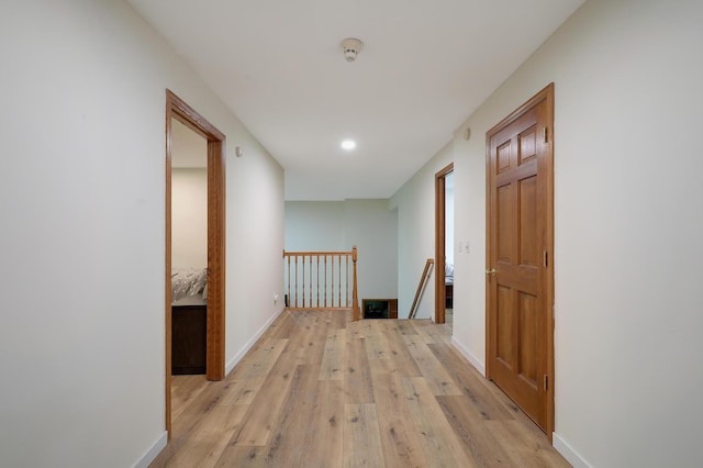 655 Trails End Rd, Minnetrista, MN 55364 - corridor with an upstairs landing, light wood finished floors, baseboards, and recessed lighting
