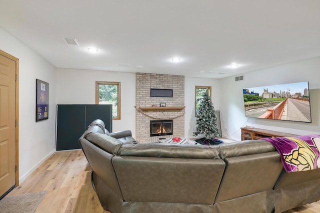 655 Trails End Rd, Minnetrista, MN 55364 - living room with light wood-style flooring, plenty of natural light, a fireplace, and recessed lighting