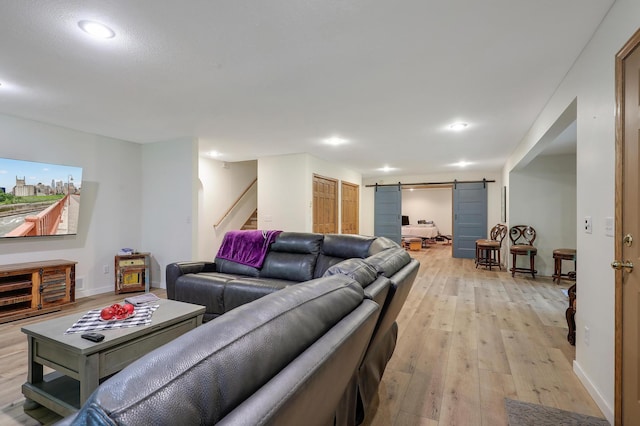 655 Trails End Rd, Minnetrista, MN 55364 - living area featuring a barn door, stairway, light wood-style floors, recessed lighting, and baseboards