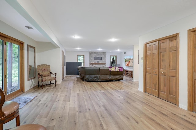 655 Trails End Rd, Minnetrista, MN 55364 - living area featuring light wood-type flooring, healthy amount of natural light, a fireplace, and recessed lighting