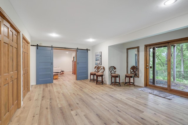 655 Trails End Rd, Minnetrista, MN 55364 - foyer featuring a barn door, light wood finished floors, and recessed lighting
