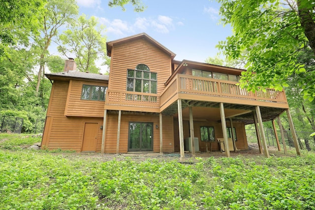 655 Trails End Rd, Minnetrista, MN 55364 - back of house featuring a chimney and a deck