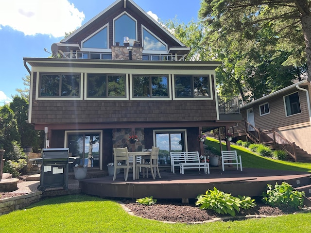 3008 Highland Blvd, Mound, MN 55364 - rear view of house with a deck, stairway, stone siding, and a yard