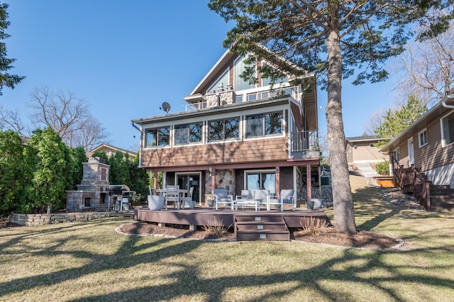 3008 Highland Blvd, Mound, MN 55364 - rear view of house featuring a balcony, a fireplace, a lawn, and a wooden deck