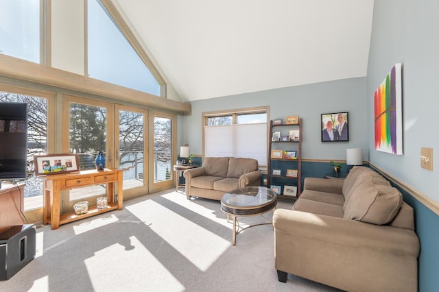 3008 Highland Blvd, Mound, MN 55364 - living room featuring french doors, high vaulted ceiling, and carpet flooring