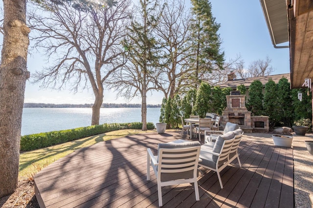 3008 Highland Blvd, Mound, MN 55364 - wooden terrace featuring an outdoor stone fireplace and a water view