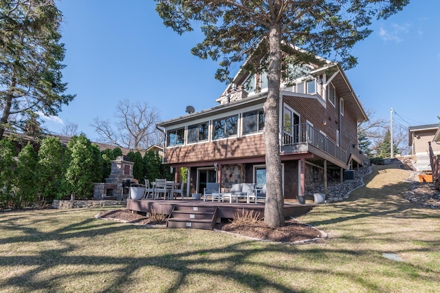 3008 Highland Blvd, Mound, MN 55364 - back of property with a wooden deck, a yard, and exterior fireplace