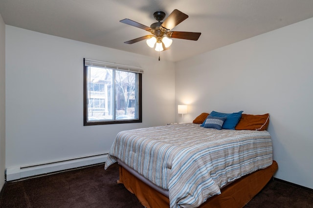 carpeted bedroom with a ceiling fan and baseboard heating