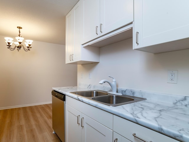 kitchen featuring stainless steel dishwasher, white cabinetry, a chandelier, a sink, and light wood finished floors