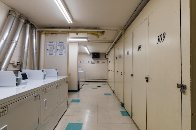 common laundry area with washer and dryer