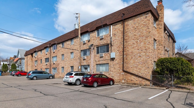 view of property featuring uncovered parking