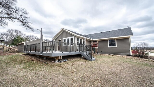 32955 County 24th Blvd, Cannon Falls, MN 55009 - rear view of property featuring a shingled roof, a wooden deck, and a lawn