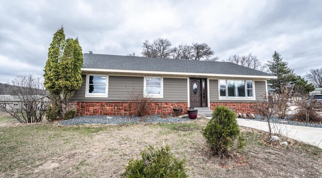 32955 County 24th Blvd, Cannon Falls, MN 55009 - view of front facade with a shingled roof and stone siding
