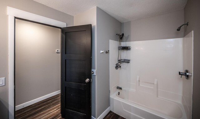 32955 County 24th Blvd, Cannon Falls, MN 55009 - full bath with wood finished floors, baseboards, and washtub / shower combination