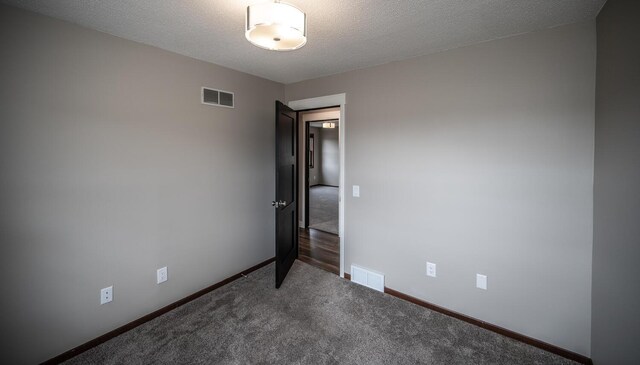 32955 County 24th Blvd, Cannon Falls, MN 55009 - carpeted spare room featuring visible vents, baseboards, and a textured ceiling