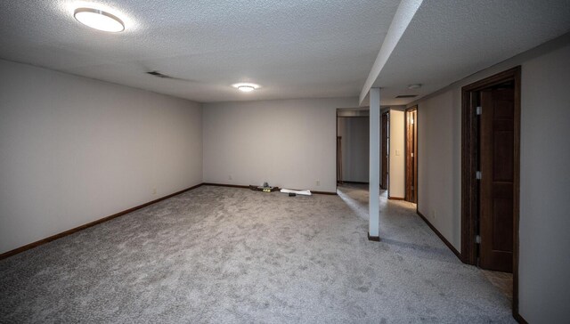 32955 County 24th Blvd, Cannon Falls, MN 55009 - finished basement featuring a textured ceiling, visible vents, baseboards, and carpet