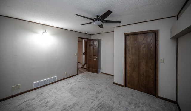 32955 County 24th Blvd, Cannon Falls, MN 55009 - unfurnished bedroom with a textured ceiling, a closet, a ceiling fan, visible vents, and carpet floors