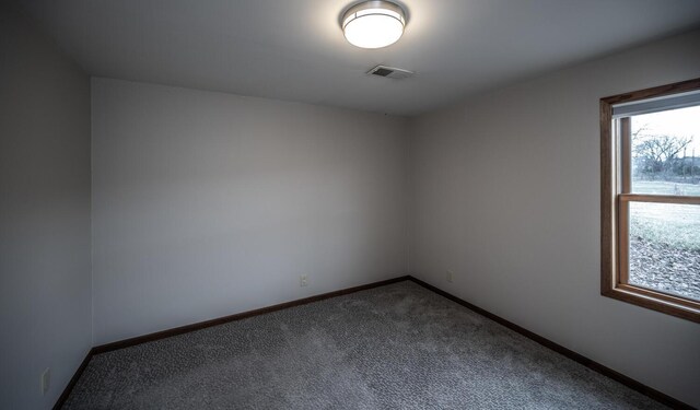 32955 County 24th Blvd, Cannon Falls, MN 55009 - empty room with visible vents, baseboards, and dark carpet