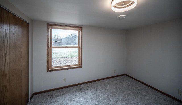 32955 County 24th Blvd, Cannon Falls, MN 55009 - spare room featuring baseboards and carpet