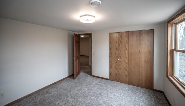 32955 County 24th Blvd, Cannon Falls, MN 55009 - unfurnished bedroom with carpet floors, baseboards, and a closet